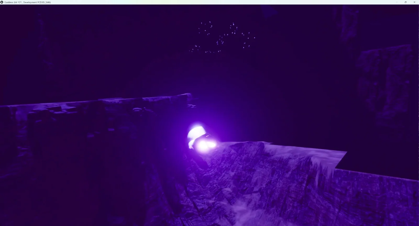 A single glowing figure standing at the edge of a dark canyon